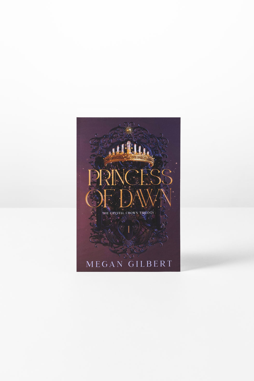 Front cover of 'Princess of Dawn', a fantasy novel by Megan Gilbert. It has a purple cover with a golden crown and text.