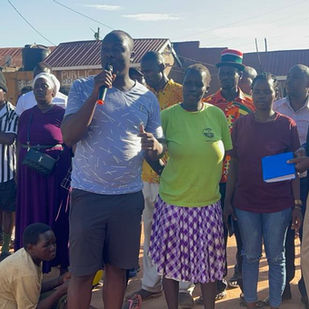 A community gathers around Allan.