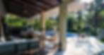 Pavones Resort villa patio with egg chair and pool
