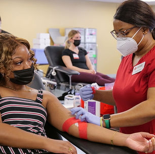 Blood donation center showing and nurse and preparing for donation