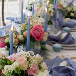 ester and erik pale pink and pale blue candles for a baby shower lunch with florals