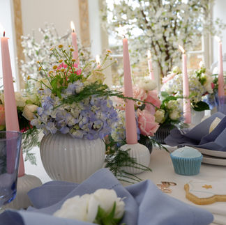ester and erik candles in pale pink and pale blue candles for a baby shower lunch with florals and blossom trees