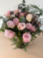 close up of 24 Large Headed Pink Roses in a Ro Collection vase