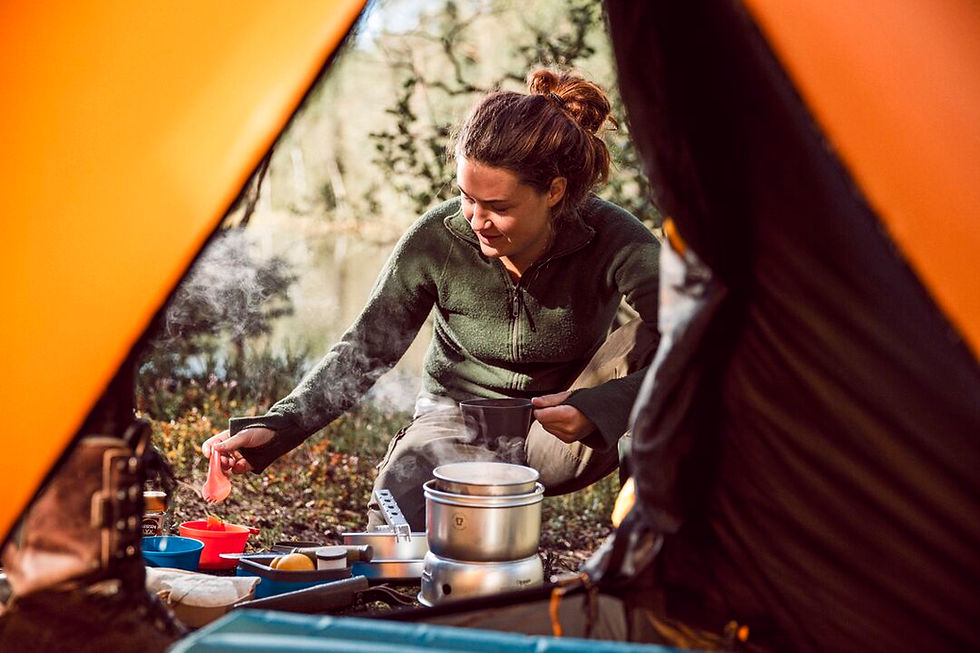 Wildo - Fold-A-Cup with a lady in a tent in the woods