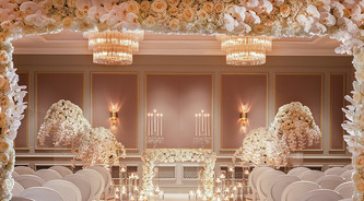 Creating exquisite florals for a ceremony at Four seasons Hotel Hampshire, photography by Richard Waite