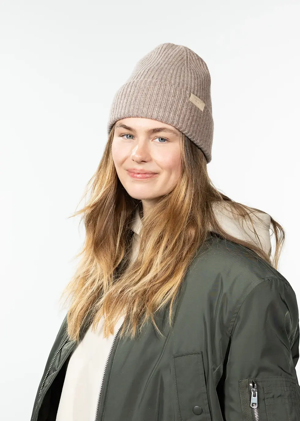 a lady in a cozy brown hat