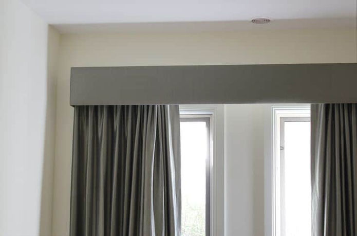 Grey fabric-covered pelmet with custom curtains in a modern Perth home