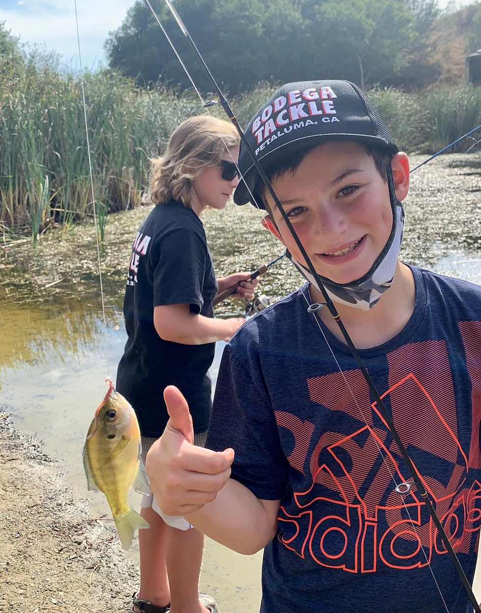 customers-two boys fishing in creek
