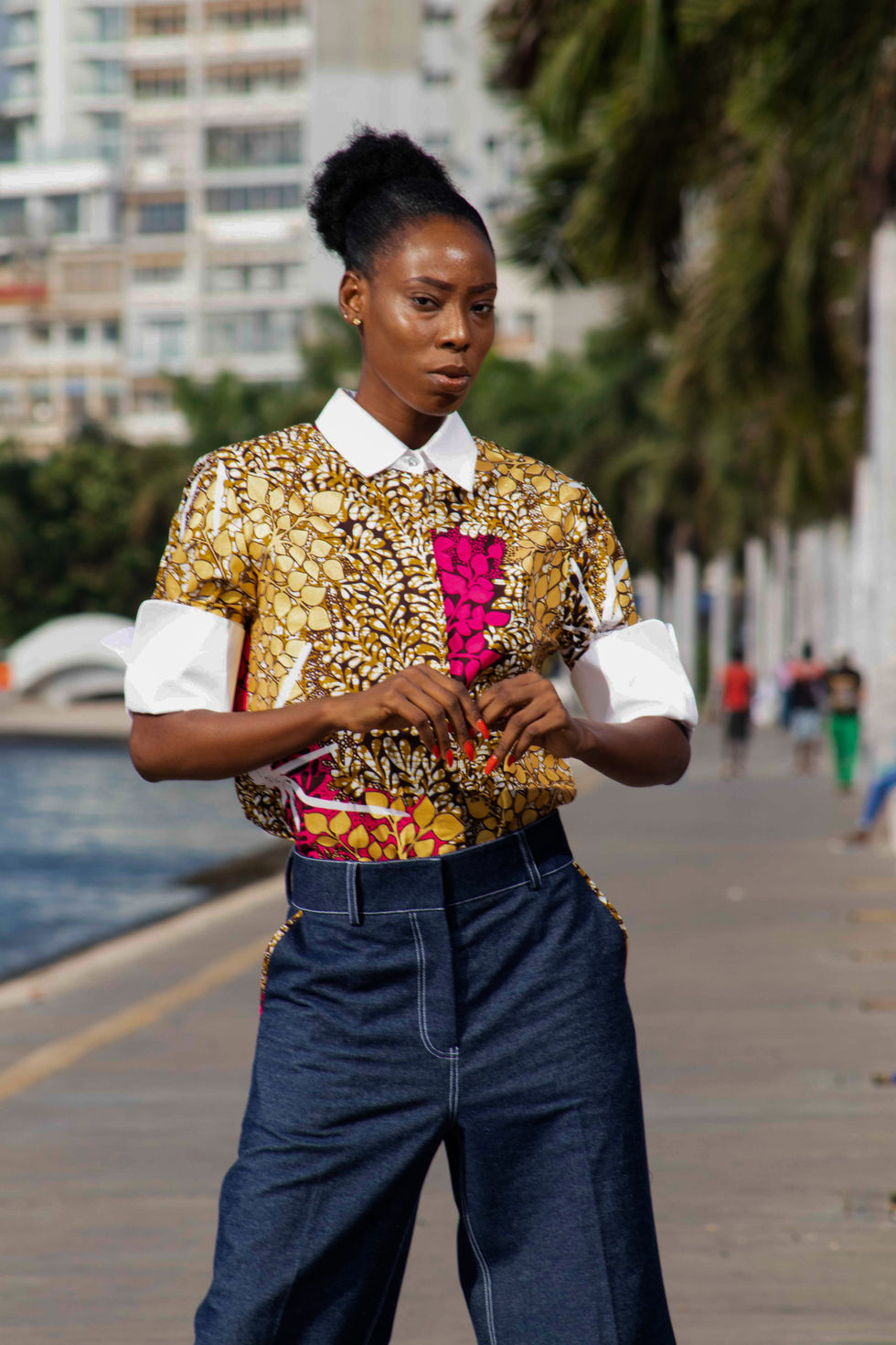 gold african print shirt with a dark denim jeans