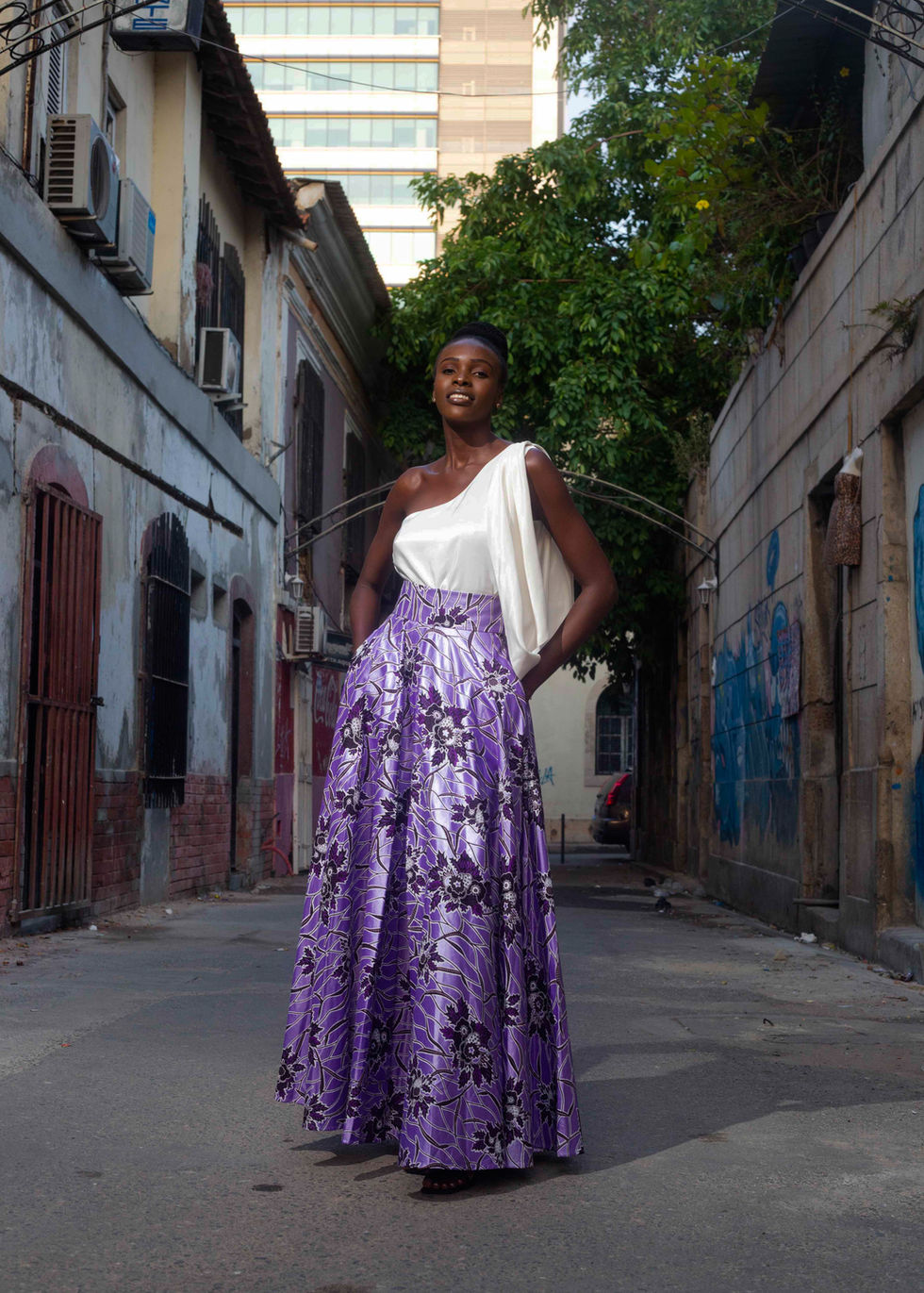 one shoulder white silk top with a lilac african printed long skirt