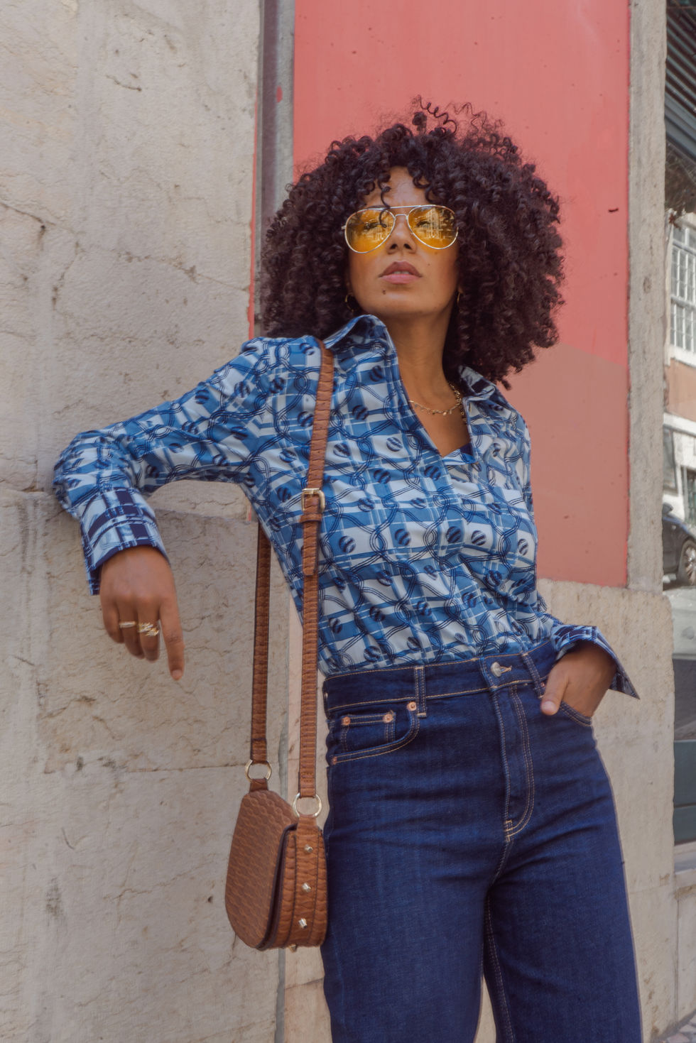 blue african printed shirt with denim jeans