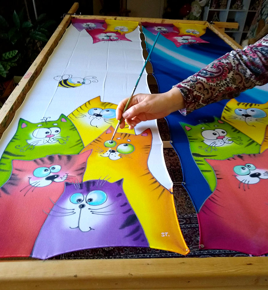 Thumbnail: Artist painting colorful cats on silk scarf by hand
