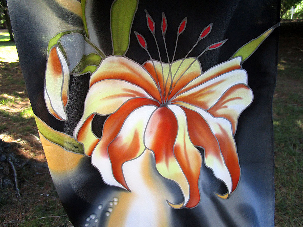 Thumbnail: Close-up of orange and white lily flower on hand-painted silk scarf.