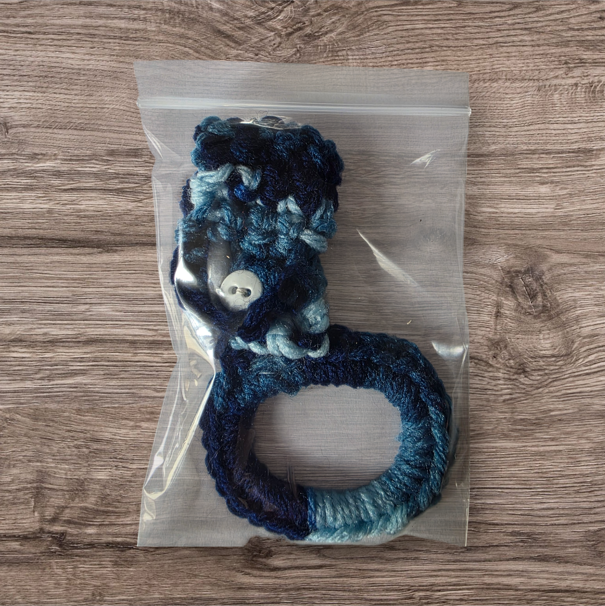 Multiple shades of blue crocheted towel holder