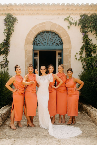 Bride and her squad. Bridesmaids coral pink dress. Luxury wedding at Commenda di san Calogero, Sicily