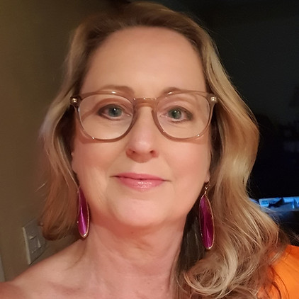 Caroline Head Shot Orange smaller.jpg