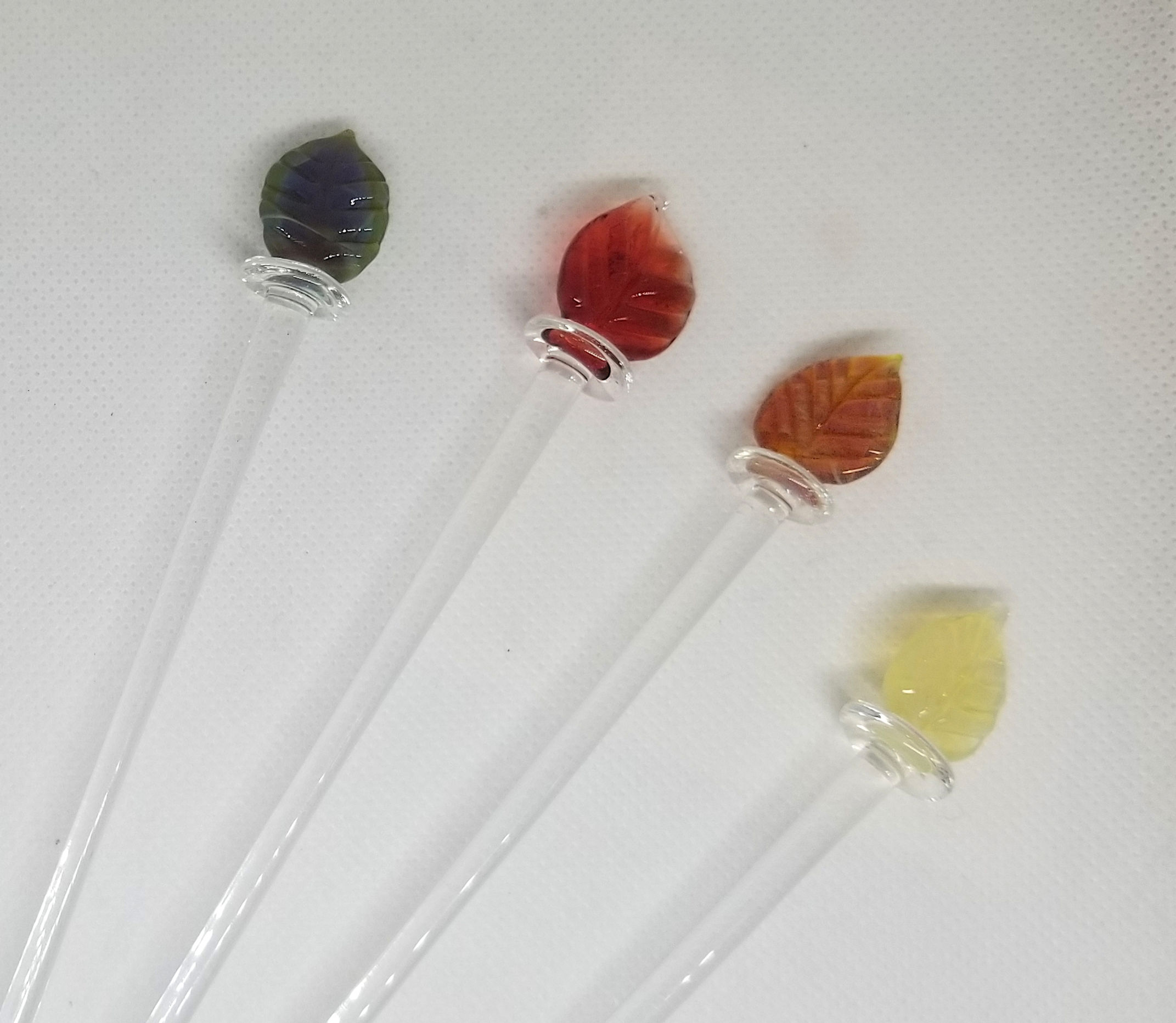 Glass cocktail stirrers, leaf design, tops