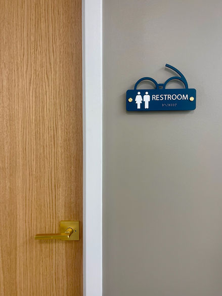 Restroom sign with gender symbols