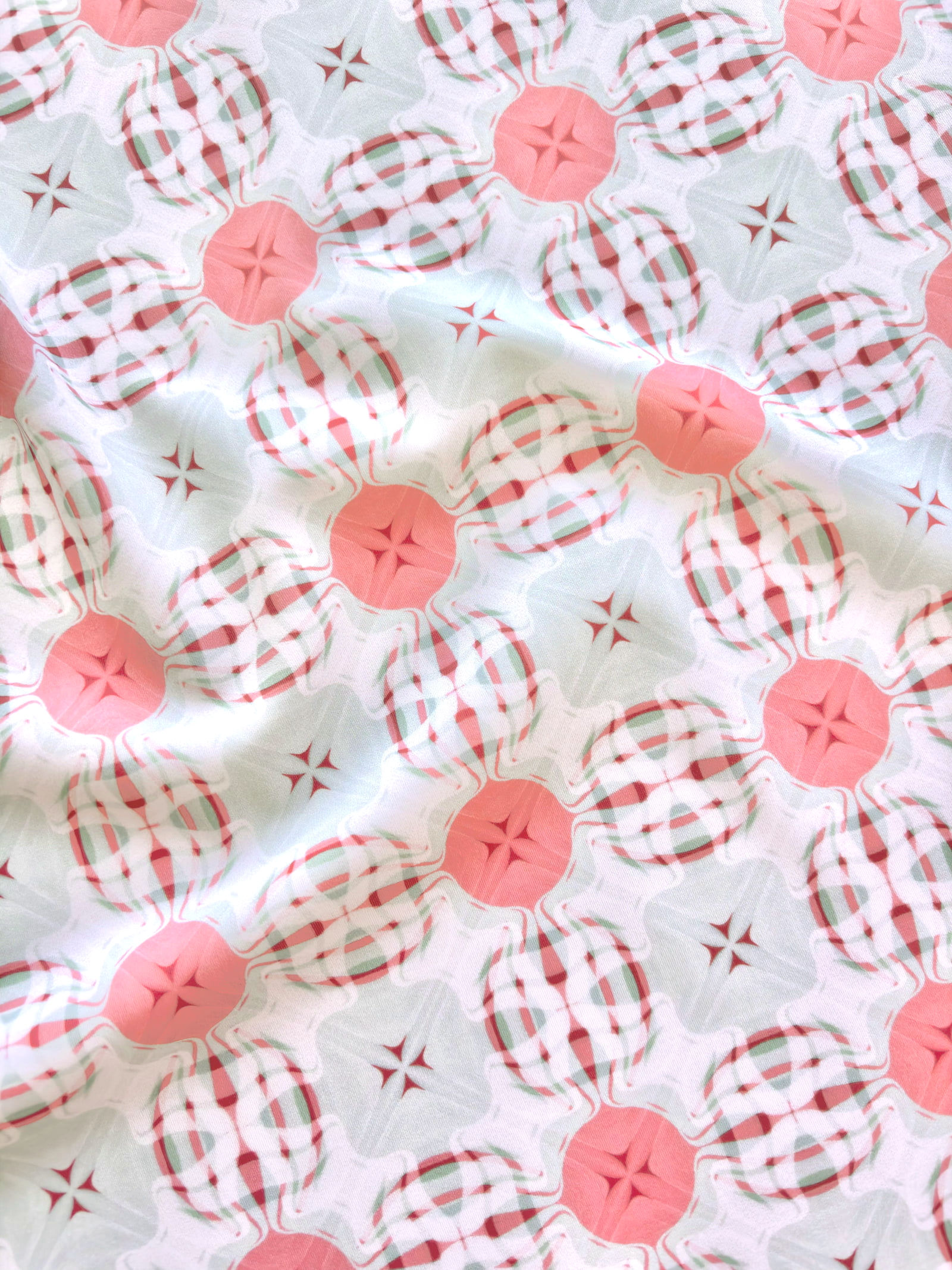tissu lycra Havasupai motif géométrique vert d'eau et corail - vue du motif plissé