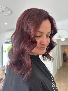 Womens haircut with wavy red hair colour