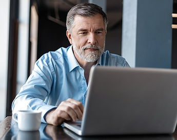 Man responding to marketing for a manufacturing company