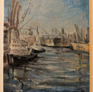 Docked tug boats in a harbor.