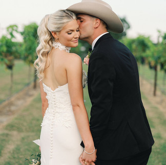 couple in vineyard on wedding day