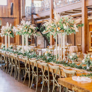 Elevated pampas grass floral arrangement with gold stand 