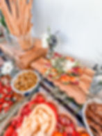 Charcuterie board ideas featuring cheese, olives, and meats.