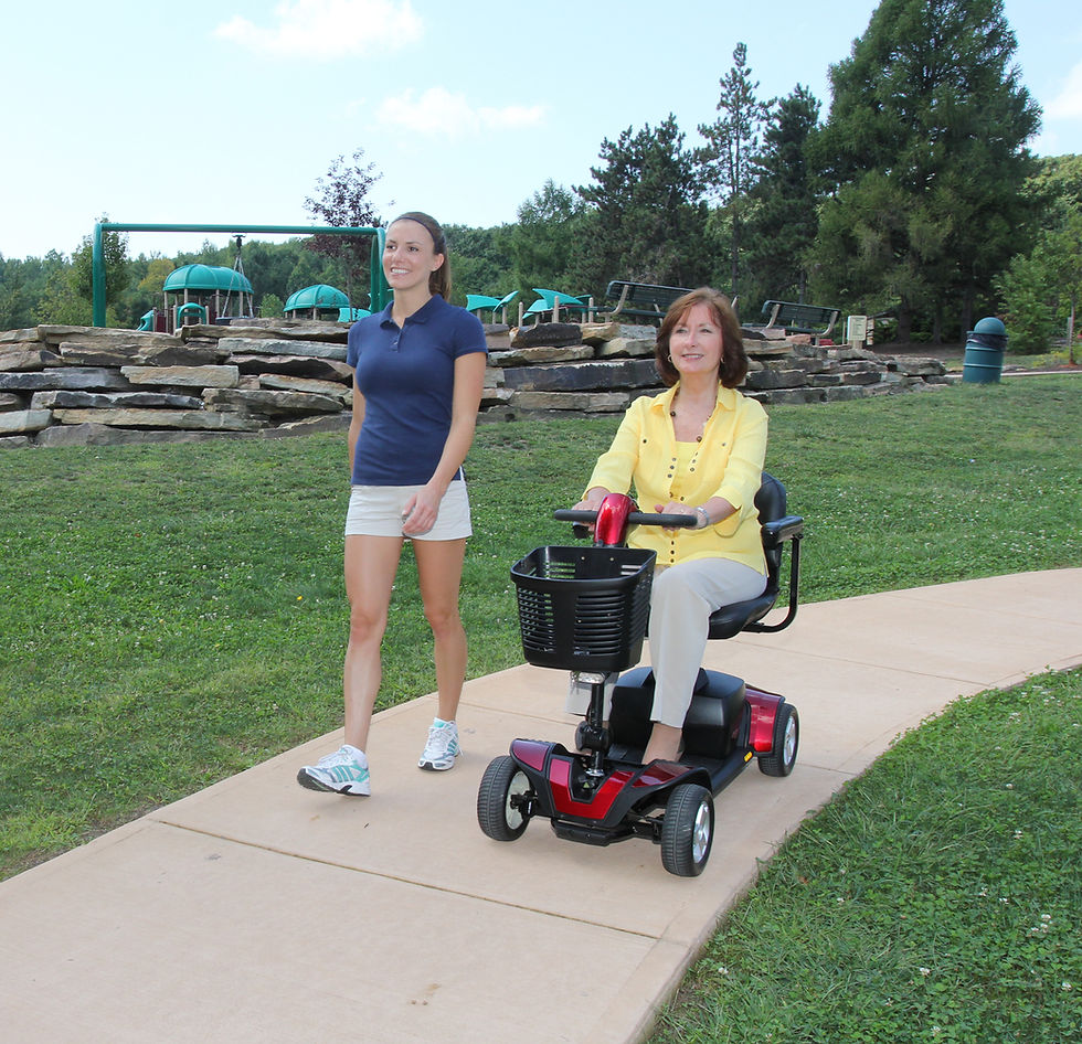 Two women on a stroll, one is in a wheelchair