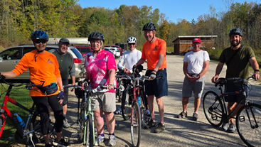 People biking the Maple Highlands trail