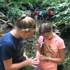 campers in a stream