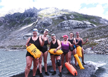 ice swimming in glacier. ice swimmers standing on iceberg in austria 