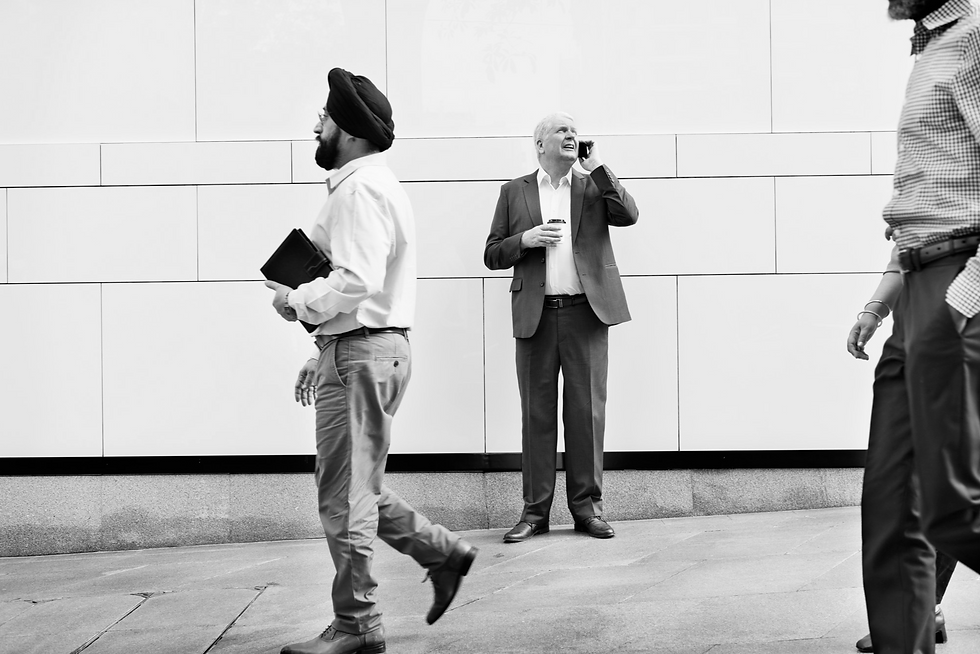 two people in front of wall