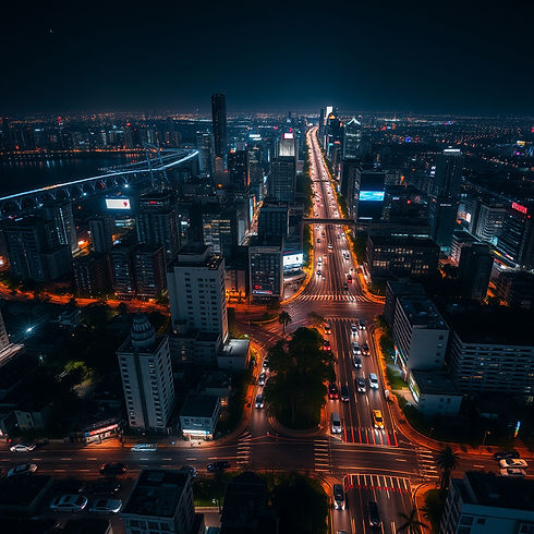 A satellite shot of cars moving around a city at night .jpg