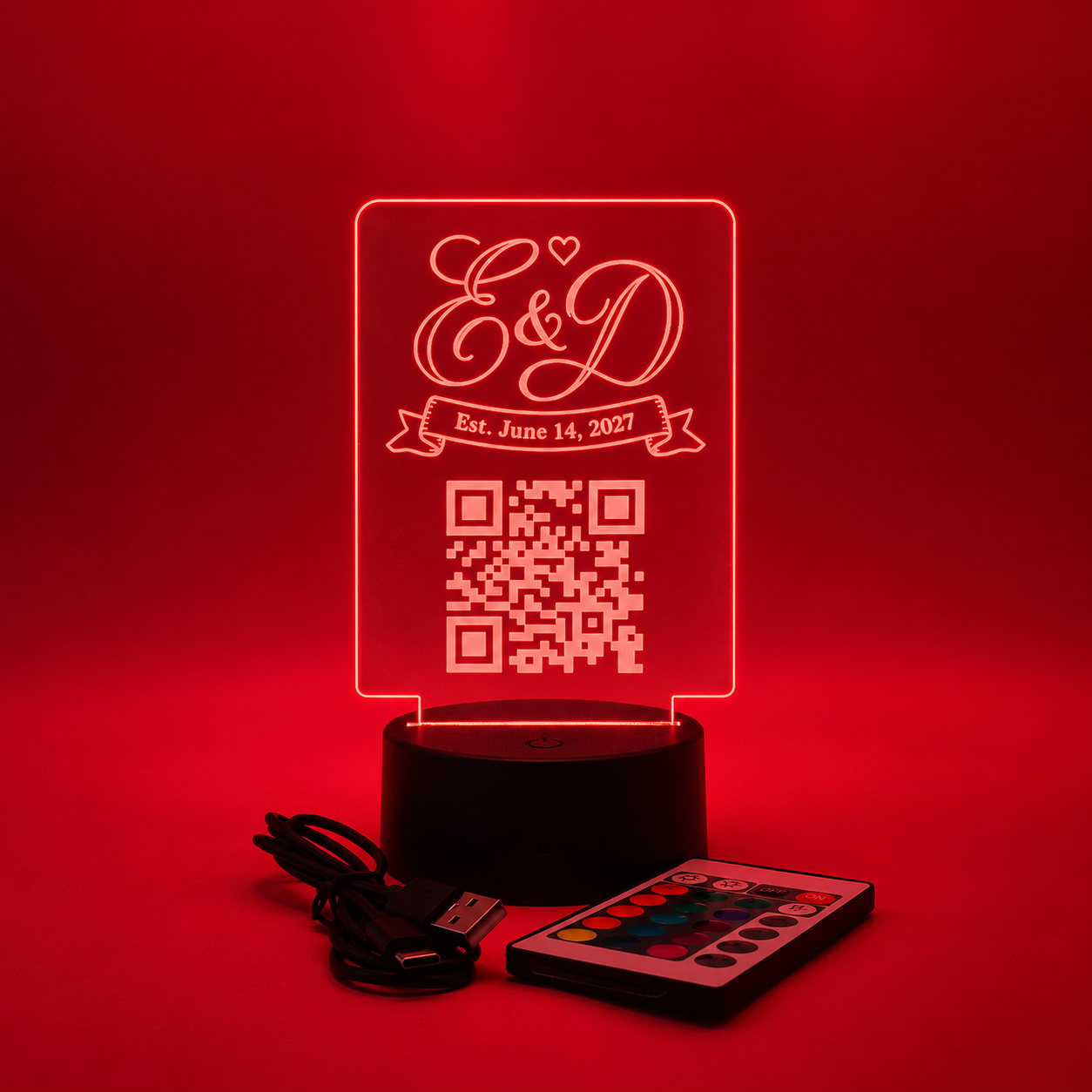 Light-up Venmo QR code wedding sign glowing red with an etched monogram, wedding date and QR code on an LED base with remote