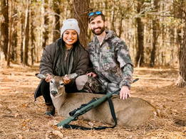 Two satisfied hunters with a harvested white-tailed deer at Triple Hollow Hunting Preserve in Altoona, Alabama, showcasing their successful hunt.