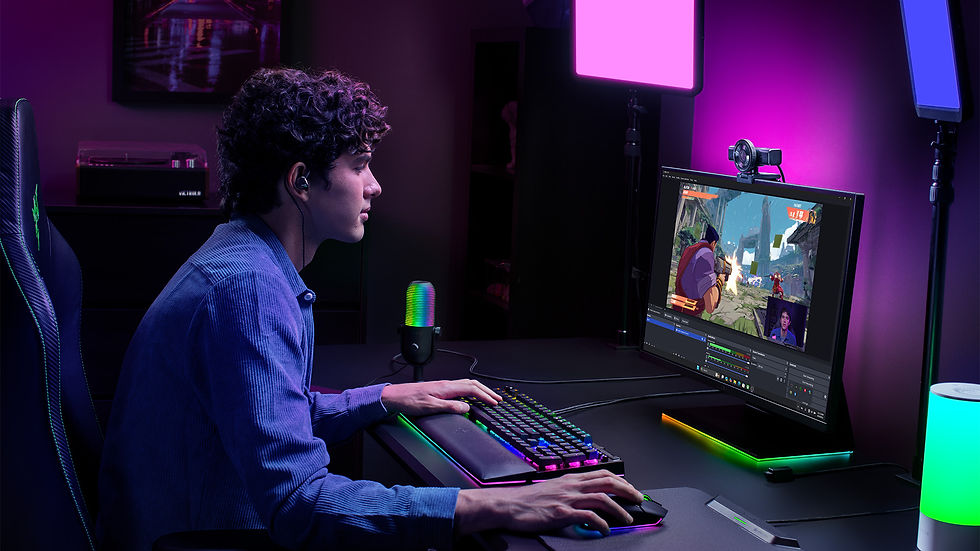 A person focused on gaming at a desk with a monitor, keyboard, and RGB lighting. The room glows with purple and blue hues.
Kiyo V2
