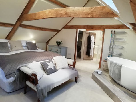 Luxury super king bedroom at The Loft holiday accommodation in rural Norfolk with exposed beams