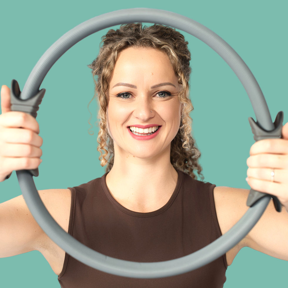 O2 Pilates instructor holding a Pilates ring in Saxonwold.