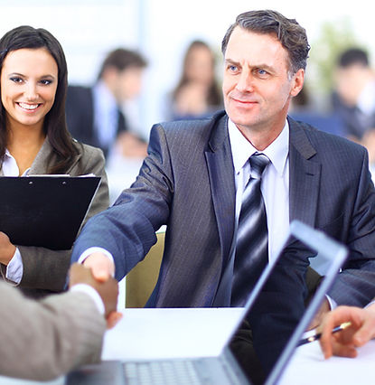 Group in suits shaking hands