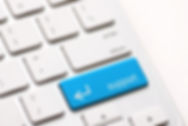 White-computer-keyboard-with-blue-key-re