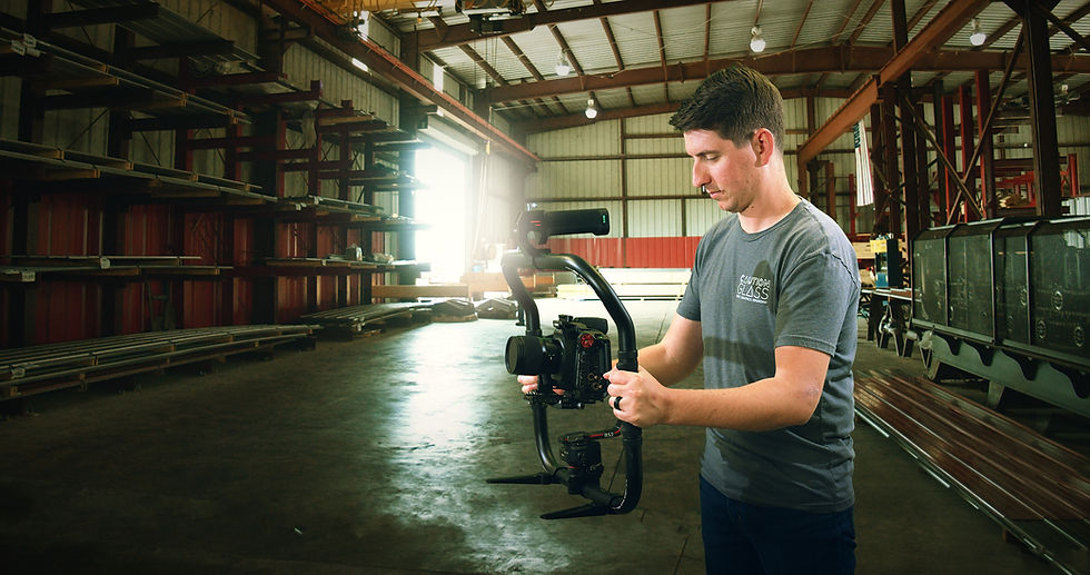 Caution Glass owner and founder Micah Pendleton filming in a warehouse