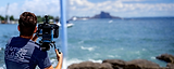 Caution Glass filming with ocean in background