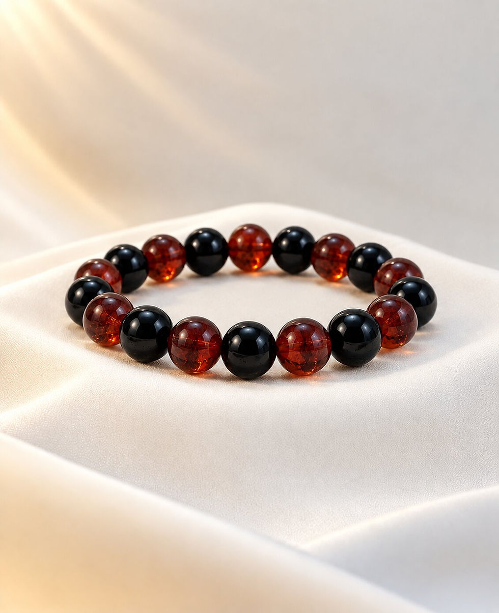 Number 4 numerology bracelet with gomed and black onyx worn on wrist by Sanskritii Sethi Global