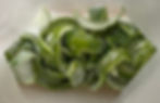 Oleo saccharum: a closeup image of limes and sugar