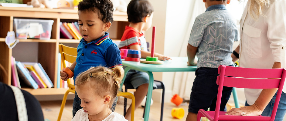 Preschool classroom with children doing different activities