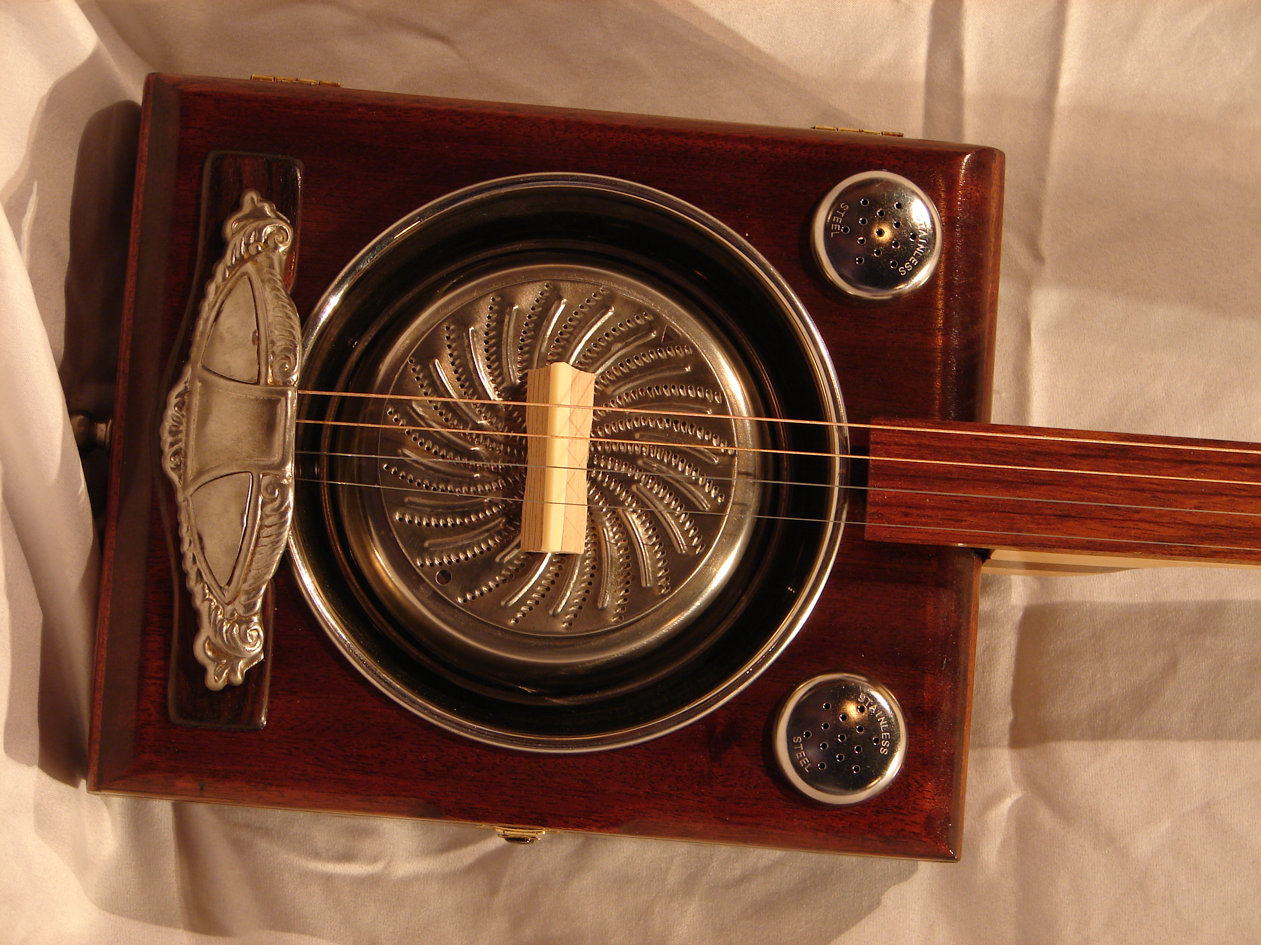 Sound holes/tailpiece