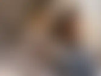 Teenage girl sitting alone in her bedroom showing signs of emotional withdrawal