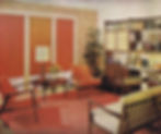 Suburban living room circa 1962 with orange and off white color palette with dark wood accents. Two midcentury modern chairs in an orange upholstery sit across from a midcentury sofa with off-white cushions. Window coverings are simple orange blinds with window wall accented by an orange geometric print wallpaper. Low midcentury table between the chairs holds a couple of decor items and a lamp. On the righthand wall is a modular bookcase desk combo with simple side chair. Bookcase is filled with books and some simple ceramic pieces. An orange rug and tall potted plant in the corner complete the space.